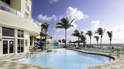 Doubletree by Hilton Ocean Point Resort pool surrounded by palm trees