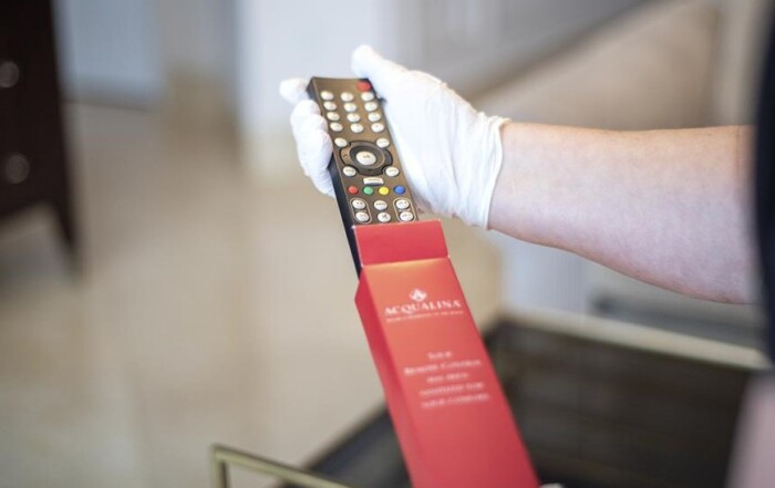 Remote being pulled out of sleeve at Acqualina